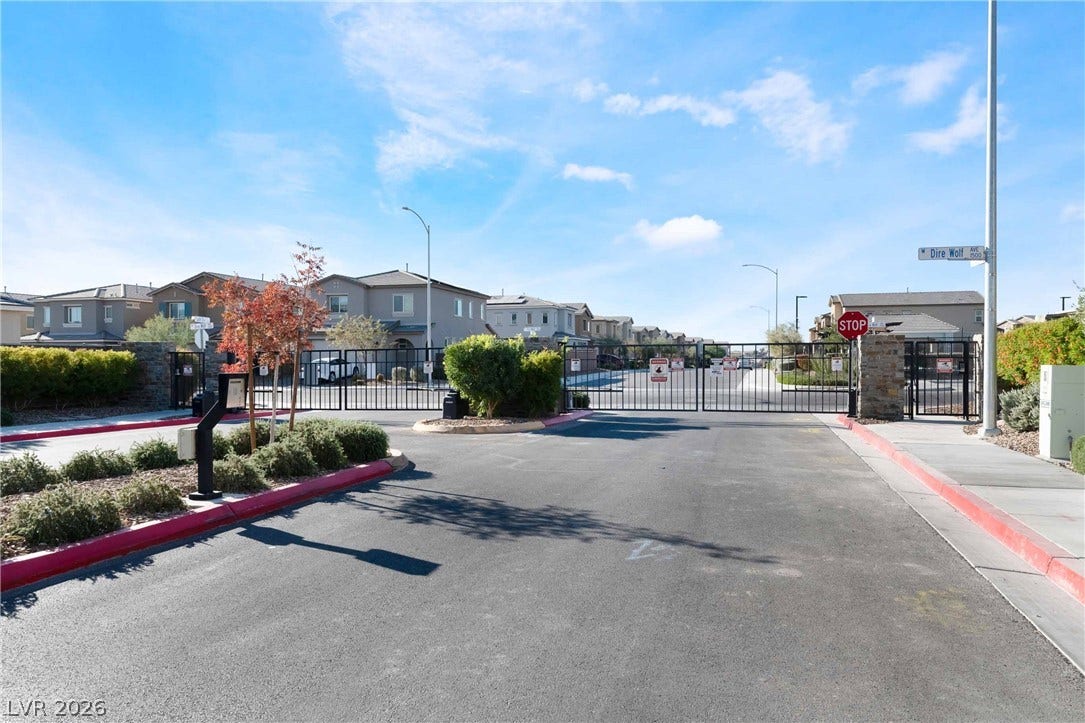 1430 Dire Wolf Avenue, North Las Vegas, NV 89084 A secure gated entrance welcomes residents to this modern suburban neighborhood.