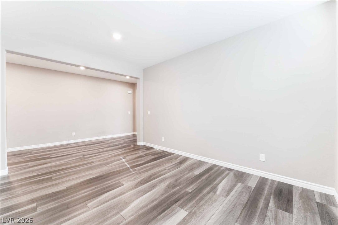 1430 Dire Wolf Avenue, North Las Vegas, NV 89084 Polished hard-surface flooring flows through a versatile, open interior with clean-lined architectural details.