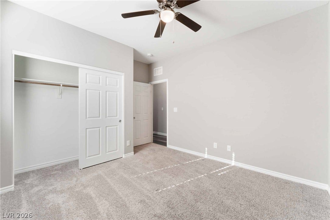 1430 Dire Wolf Avenue, North Las Vegas, NV 89084 Plush wall-to-wall carpeting and clean neutral walls anchor this versatile secondary space.