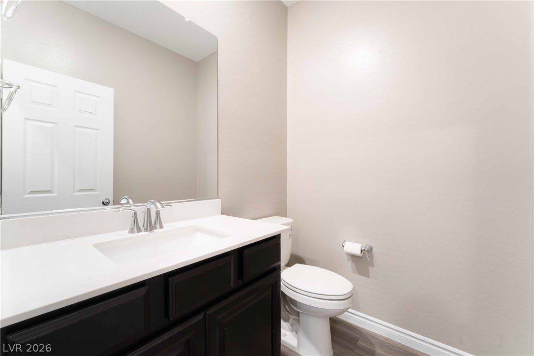 1430 Dire Wolf Avenue, North Las Vegas, NV 89084 Clean lines and a modern vanity define this pristine half bath.