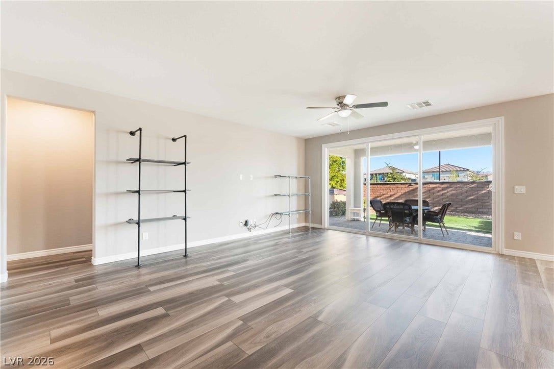 1430 Dire Wolf Avenue, North Las Vegas, NV 89084 Sliding glass doors connect the spacious main living area directly to the private backyard patio.