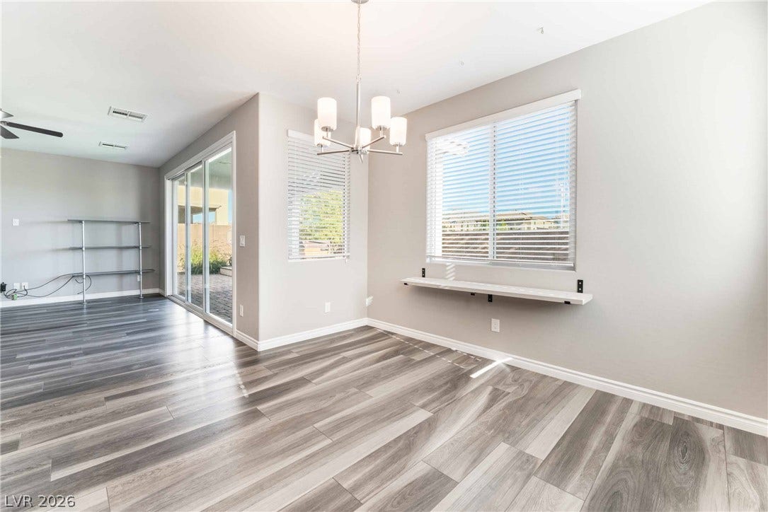 1430 Dire Wolf Avenue, North Las Vegas, NV 89084 Clean lines and wood-look flooring define this light-filled dining space.