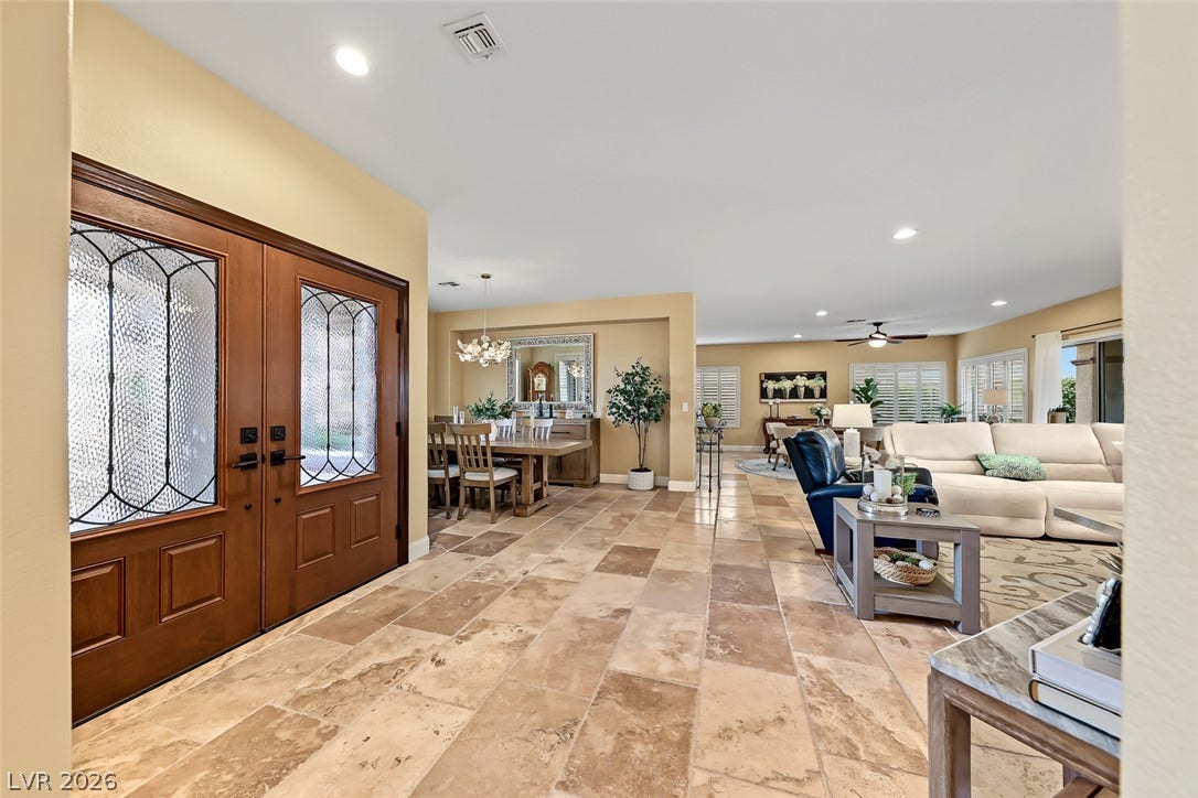 1646 Sebring Hills Drive, Henderson, NV 89052 Stately double entry doors open into an expansive tiled foyer leading to open living areas.