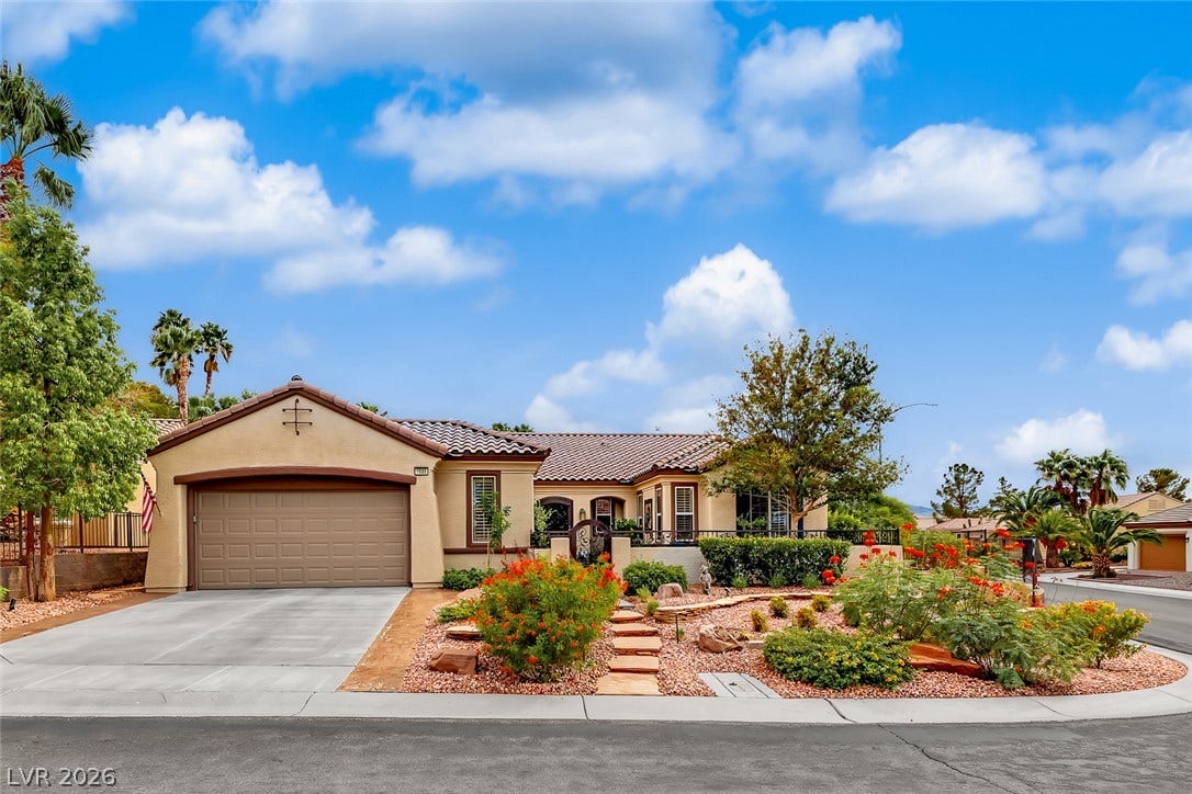 1646 Sebring Hills Drive, Henderson, NV 89052 Spanish tile roofing and desert-friendly landscaping elevate this classic suburban facade.