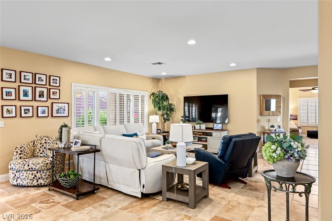 1646 Sebring Hills Drive, Henderson, NV 89052 An inviting family room showcases warm tile flooring and recessed overhead lighting.