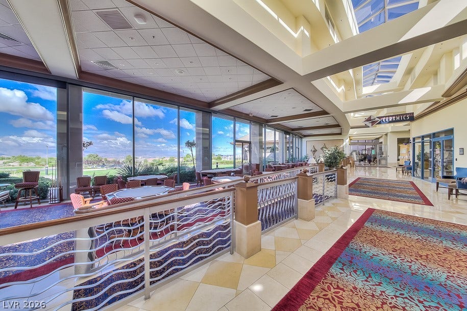 1646 Sebring Hills Drive, Henderson, NV 89052 Massive walls of glass capture expansive desert horizons beneath architectural skylights.