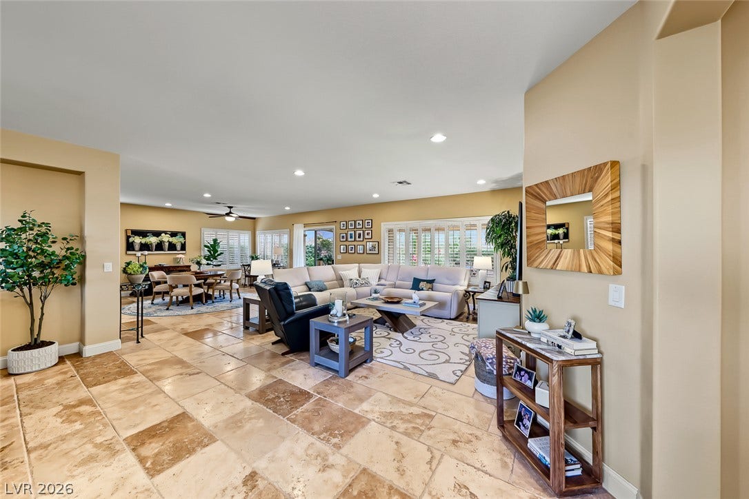 1646 Sebring Hills Drive, Henderson, NV 89052 Stone tile flooring flows through the open floorplan connecting the living and dining areas.