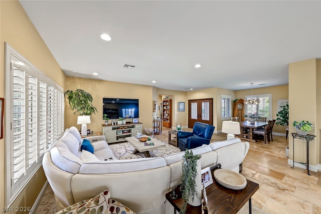1646 Sebring Hills Drive, Henderson, NV 89052 Gleaming tile floors and recessed lighting anchor this airy open concept living and dining space.
