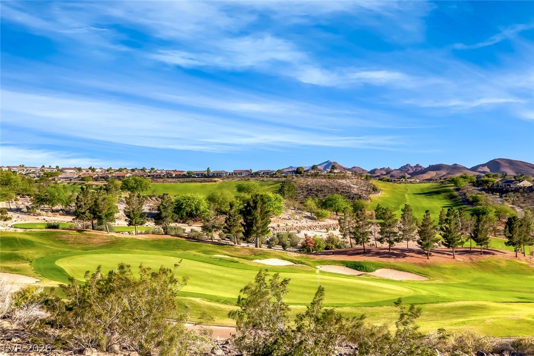 1646 Sebring Hills Drive, Henderson, NV 89052 Rolling fairways extend toward rugged mountain ridges under expansive blue skies.