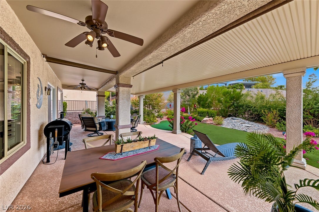 1646 Sebring Hills Drive, Henderson, NV 89052 An expansive covered patio provides comfortable outdoor dining and overlooks a beautifully landscaped backyard.