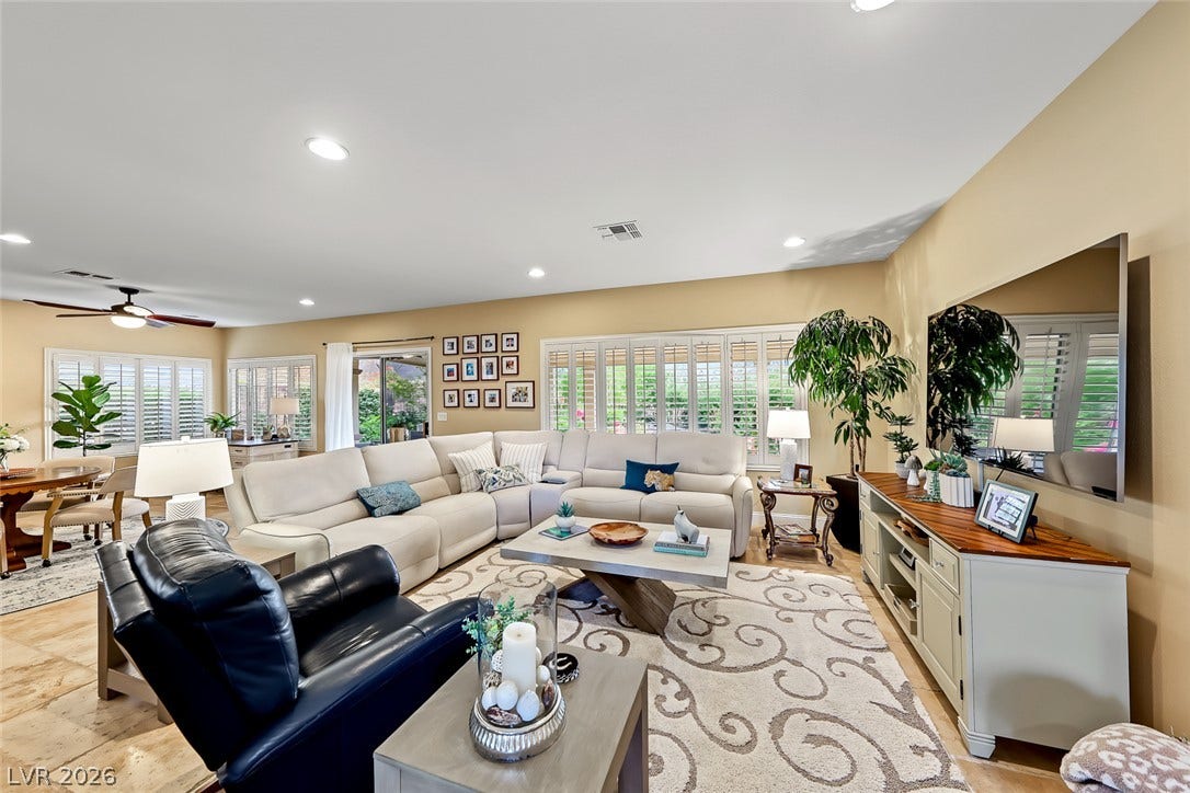 1646 Sebring Hills Drive, Henderson, NV 89052 Recessed lighting and stone-look tile flooring enhance this comfortable open-concept living space.