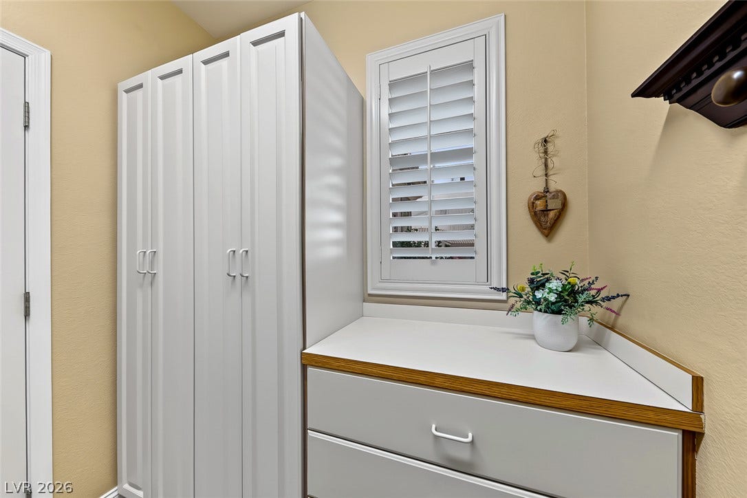 1646 Sebring Hills Drive, Henderson, NV 89052 Custom cabinetry and plantation shutters provide classic architectural detail and functional storage.