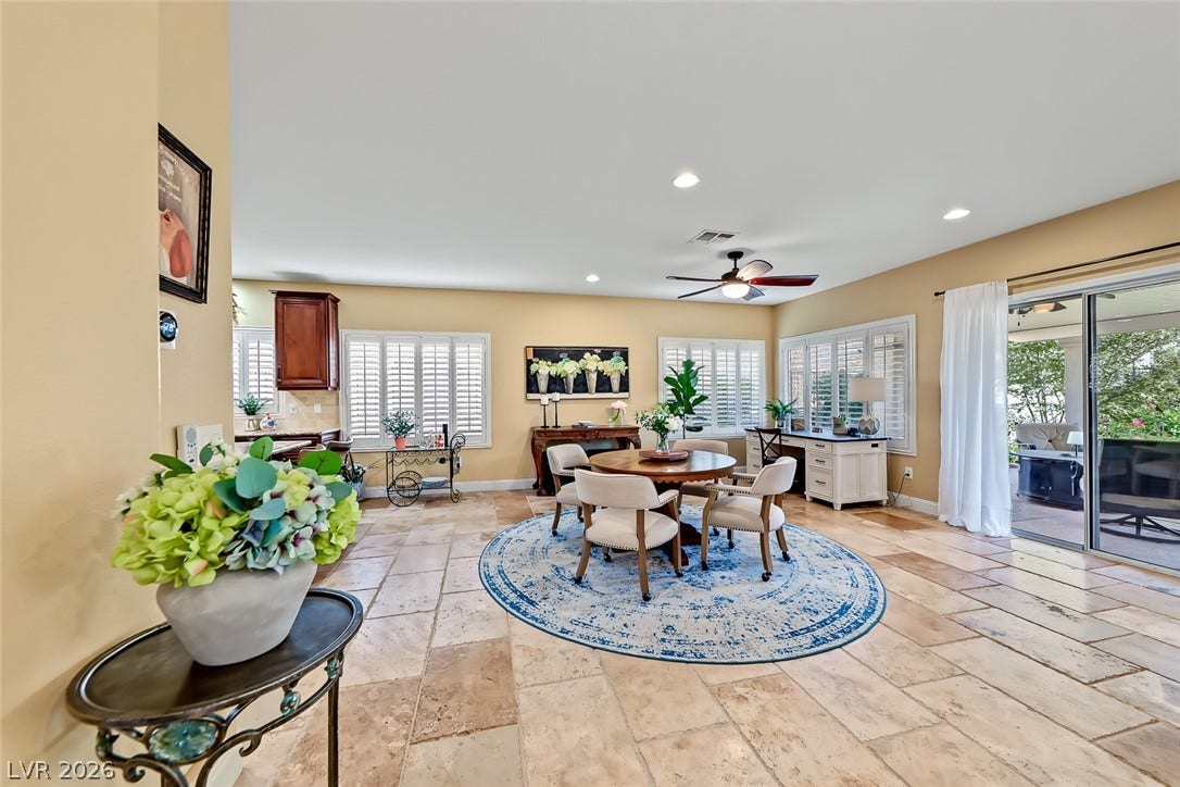 1646 Sebring Hills Drive, Henderson, NV 89052 Stone tile flooring and plantation shutters define this versatile and open dining area.