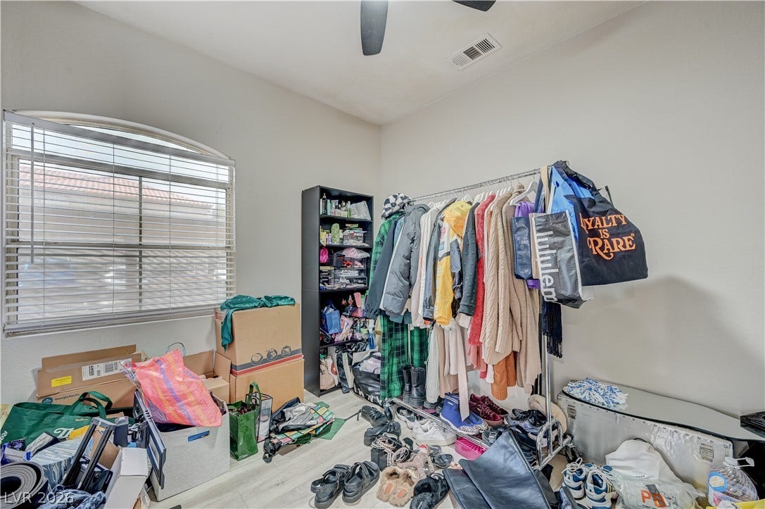 5415 W Harmon Avenue, #1029, Las Vegas, NV 89103 Smooth hard surface flooring runs beneath a large arched window in this versatile space.