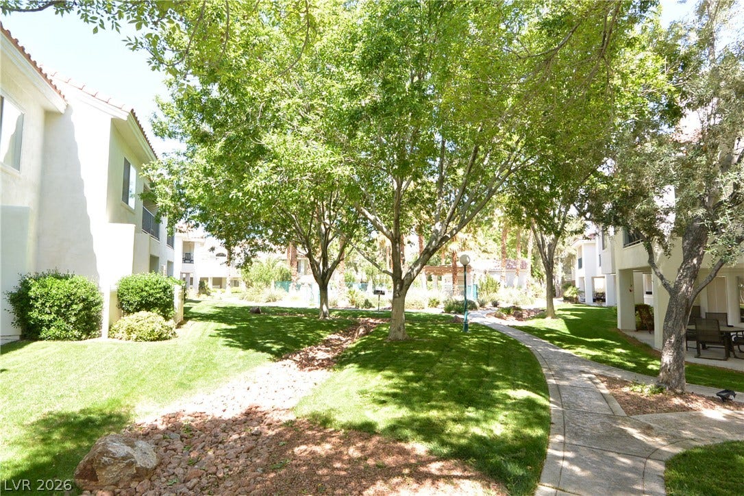 7652 Rolling View Drive, #202, Las Vegas, NV 89149 Mature trees and paved walkways wind through this beautifully landscaped common area.