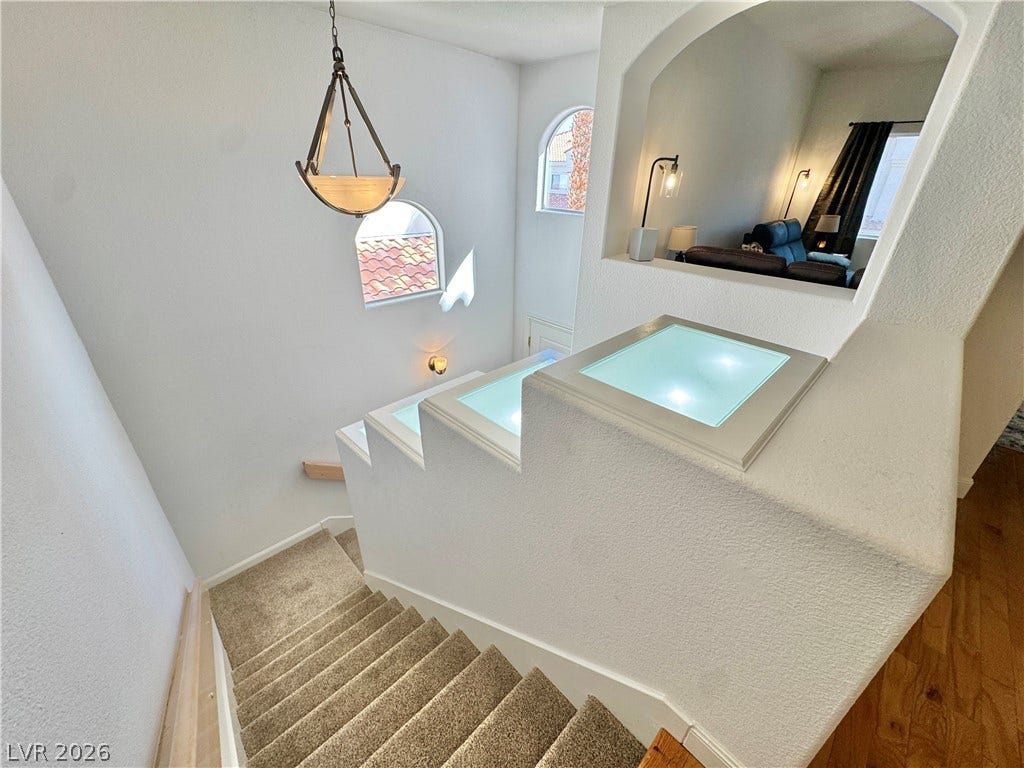 7652 Rolling View Drive, #202, Las Vegas, NV 89149 Arched windows and a dynamic stairway overlook.