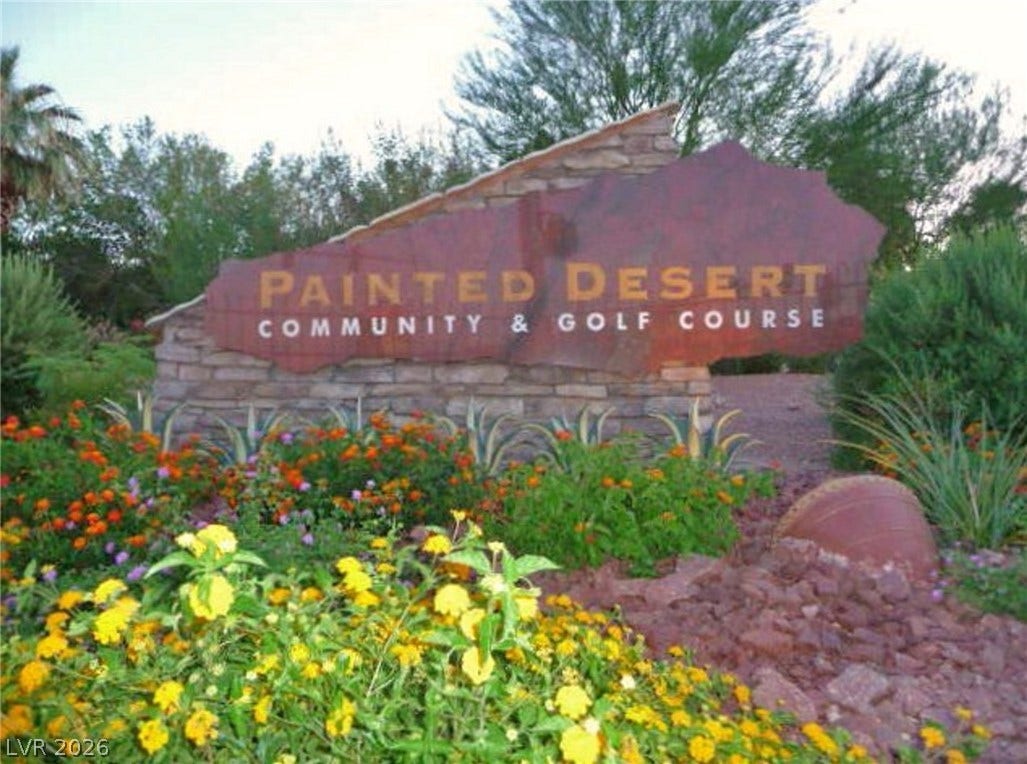7652 Rolling View Drive, #202, Las Vegas, NV 89149 Welcoming Painted Desert stone monument sign stands framed by lush desert landscaping.