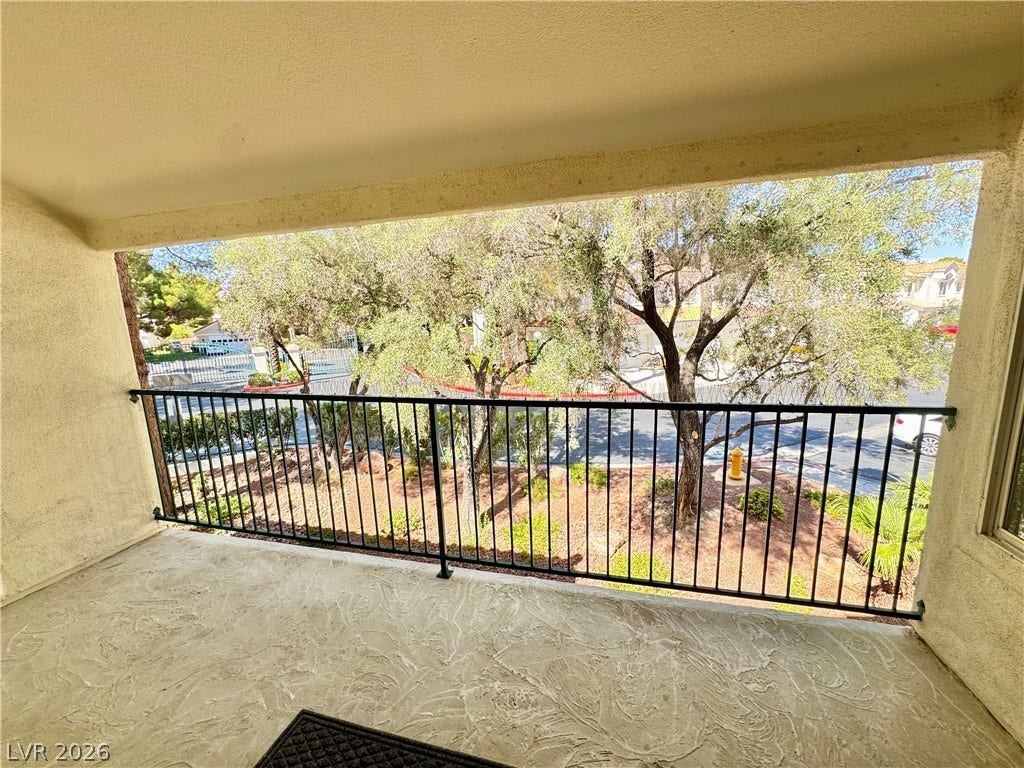 7652 Rolling View Drive, #202, Las Vegas, NV 89149 A private covered balcony overlooks the surrounding neighborhood landscaping.