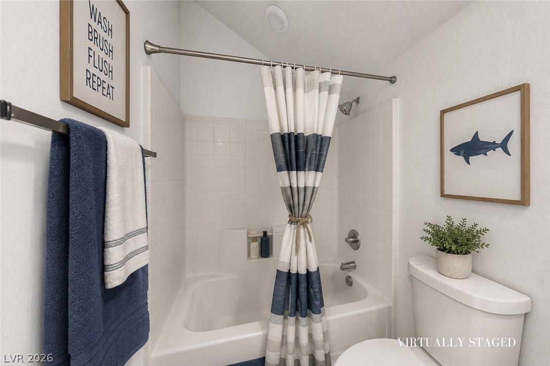 792 Valley Rise Drive, Henderson, NV 89052 An inviting bathroom features a classic tub shower combination and crisp tiled walls.