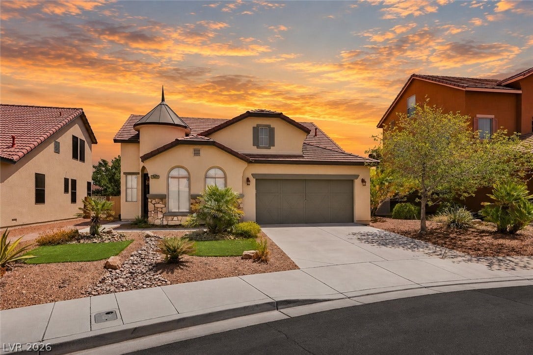 792 Valley Rise Drive, Henderson, NV 89052 Mediterranean architectural details grace this welcoming suburban home with its striking turreted entryway.