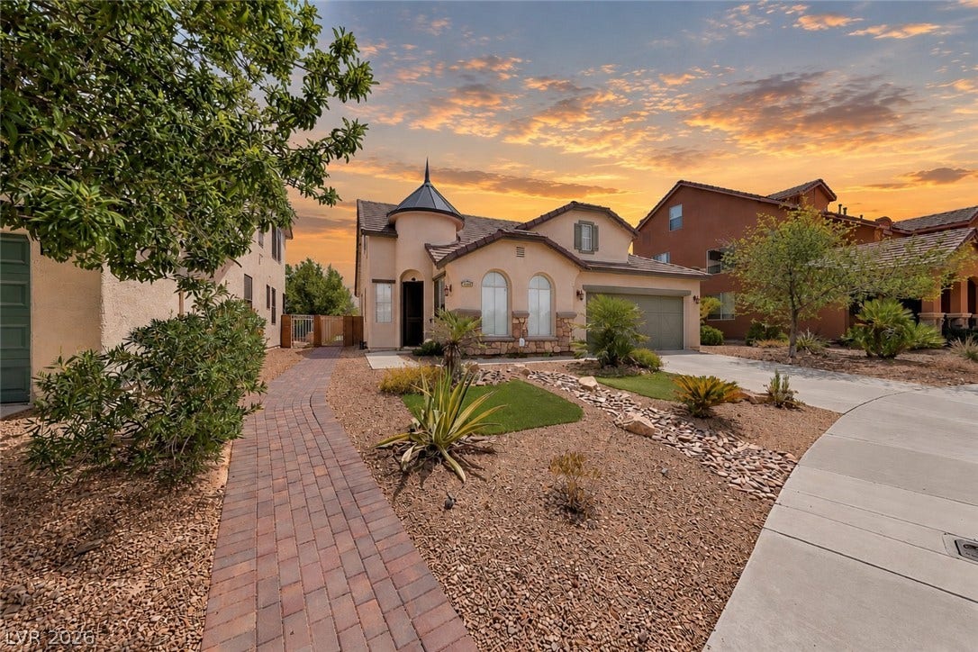792 Valley Rise Drive, Henderson, NV 89052 Elegant architectural details define this custom home featuring a unique turret and desert-inspired landscaping.