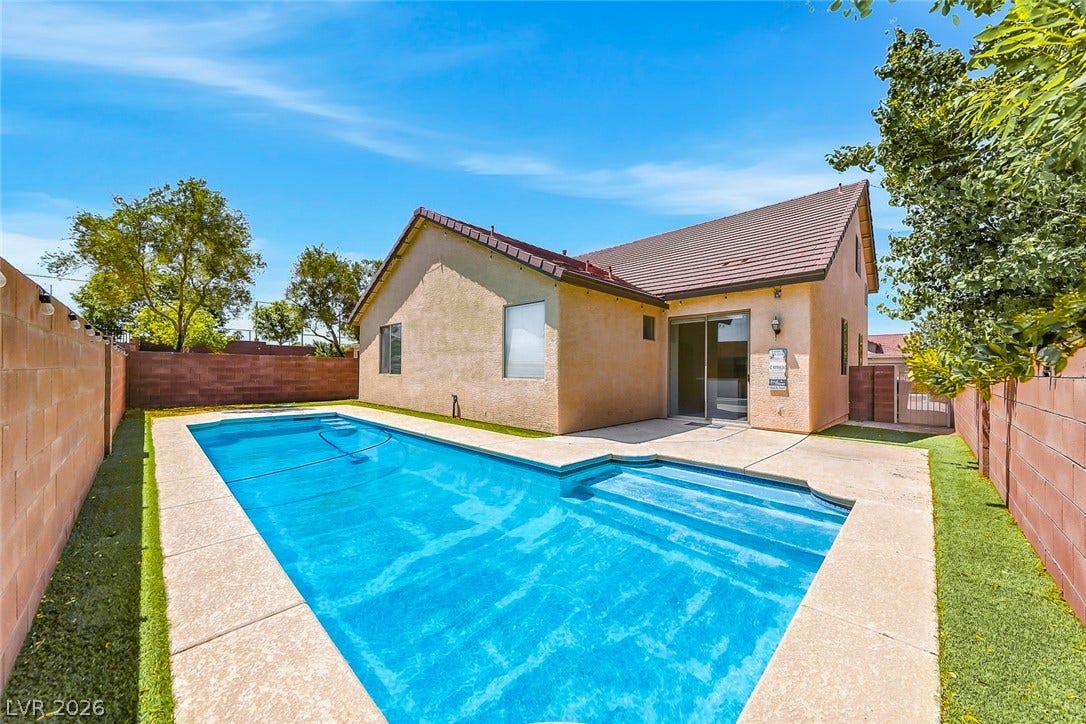 792 Valley Rise Drive, Henderson, NV 89052 An inviting swimming pool anchor this private backyard with block walls and concrete patio areas.