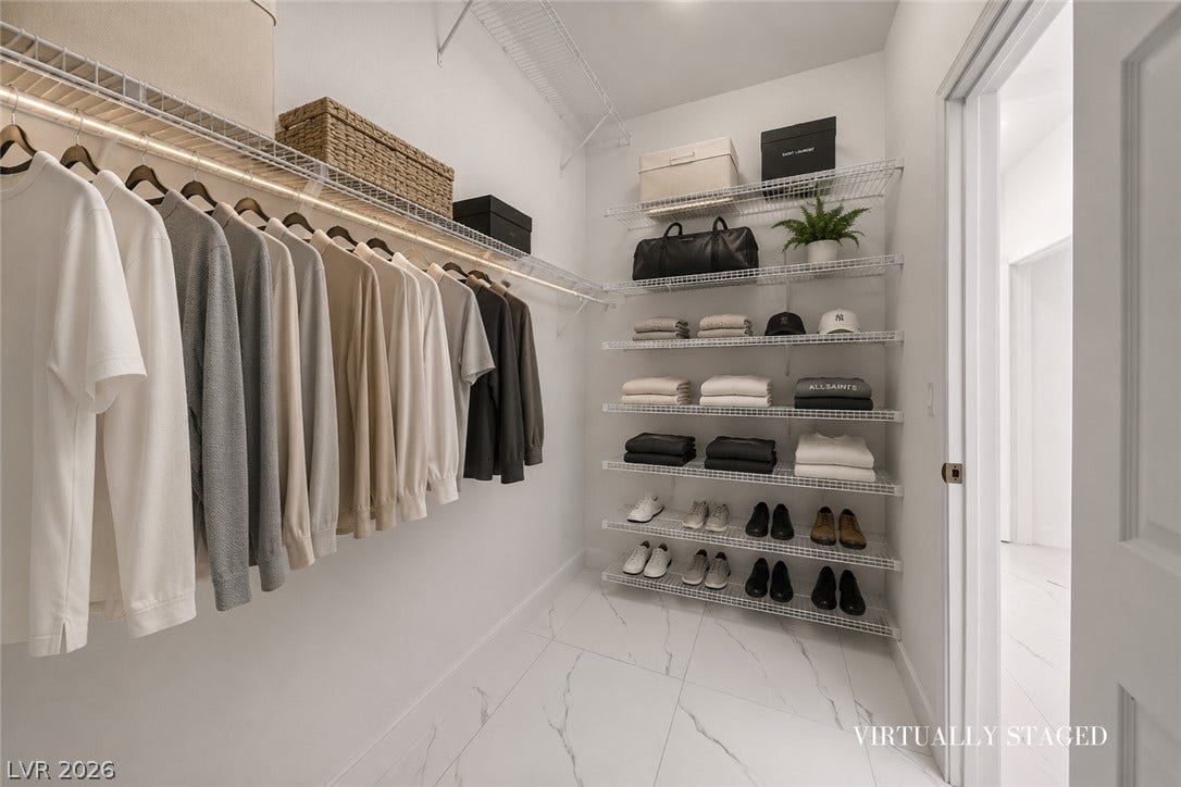 792 Valley Rise Drive, Henderson, NV 89052 Polished tile flooring and integrated wire shelving define this spacious walk-in closet.