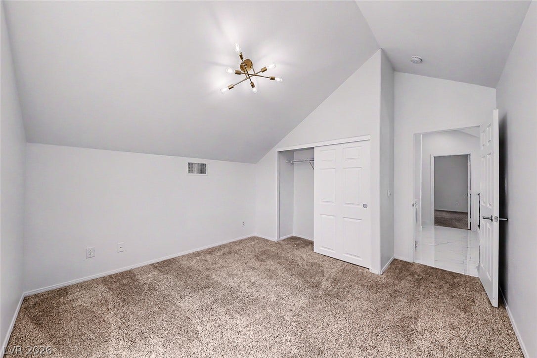 792 Valley Rise Drive, Henderson, NV 89052 Slanted ceilings and plush carpeting define this versatile upper-level room.
