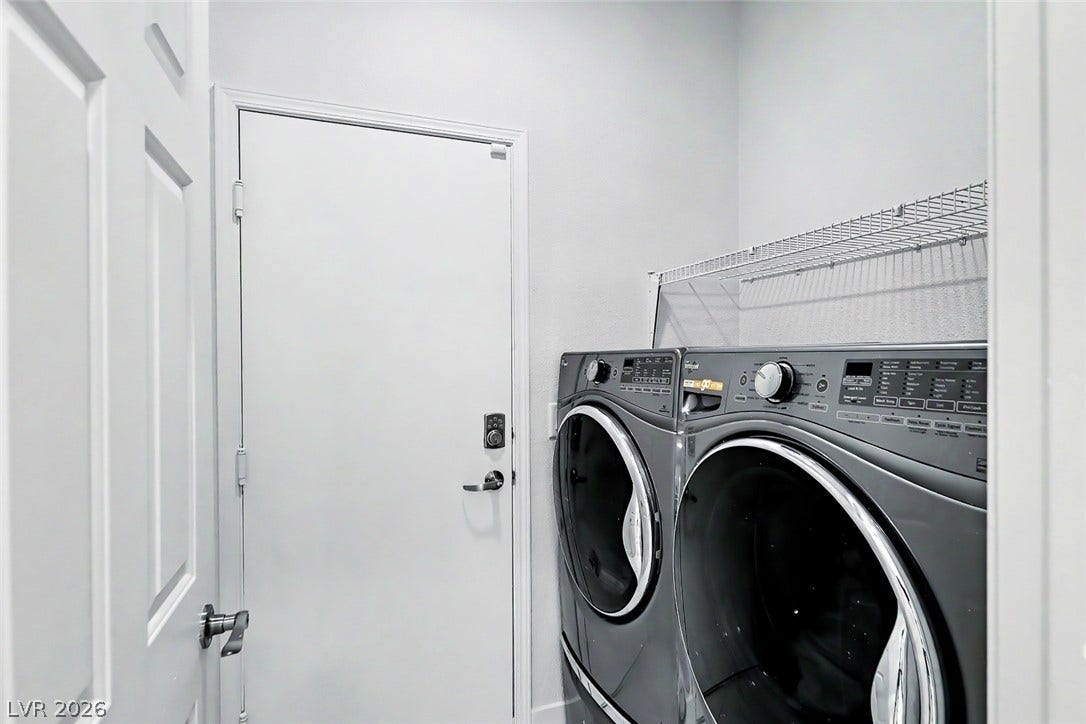 792 Valley Rise Drive, Henderson, NV 89052 A functional laundry area includes modern appliances and practical wire shelving.