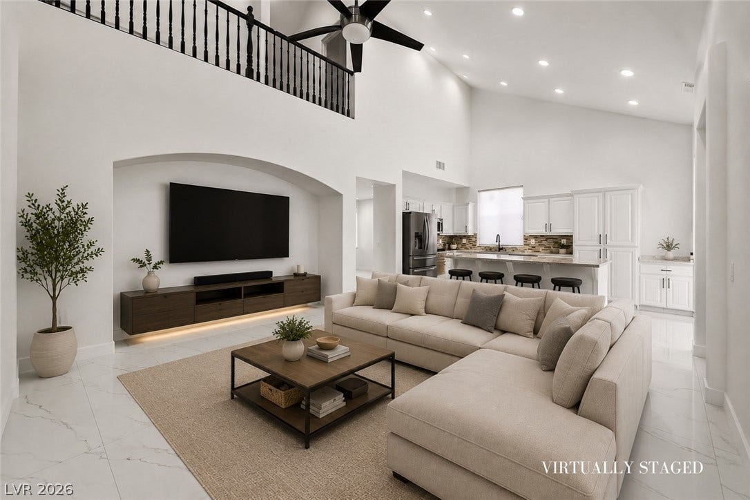 792 Valley Rise Drive, Henderson, NV 89052 An open floorplan connects the vaulted living area to a modern kitchen with tiled flooring.