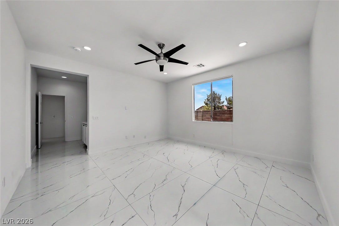 792 Valley Rise Drive, Henderson, NV 89052 Polished tile flooring and recessed lighting define this versatile interior space.