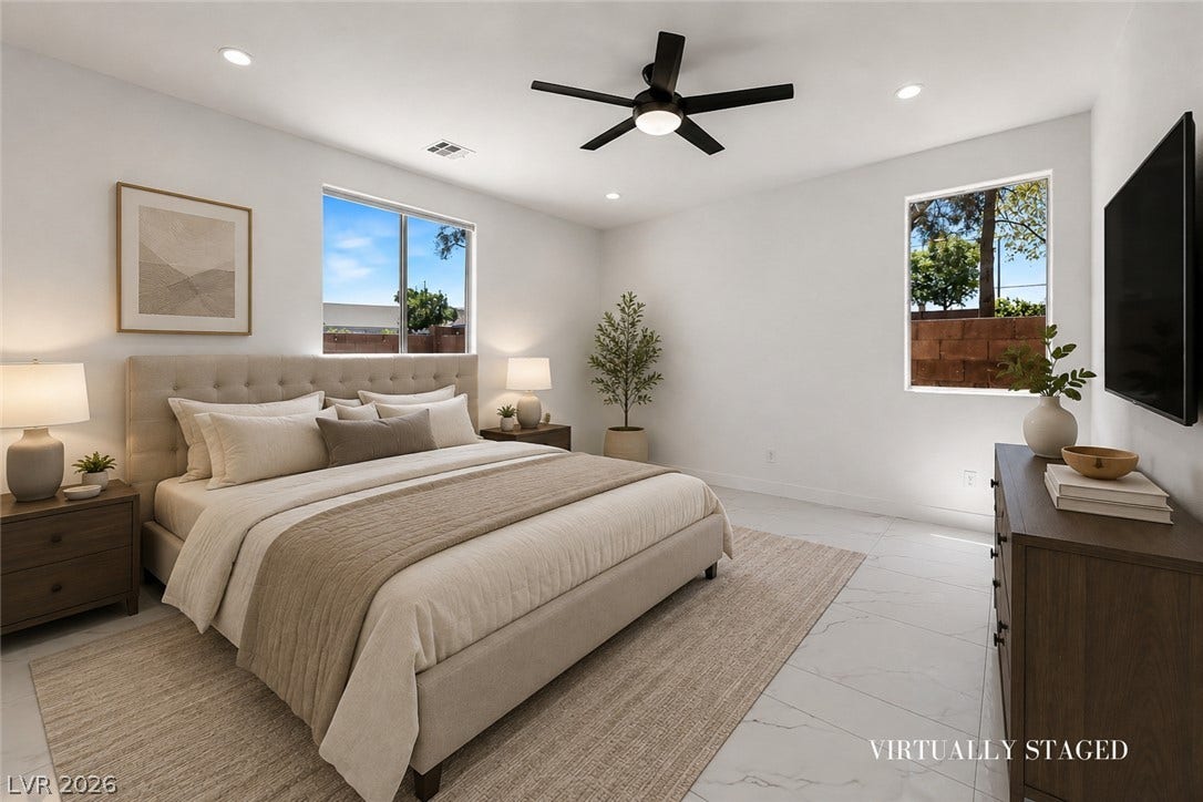 792 Valley Rise Drive, Henderson, NV 89052 Gleaming tile floors and large windows define this serene and airy modern bedroom.