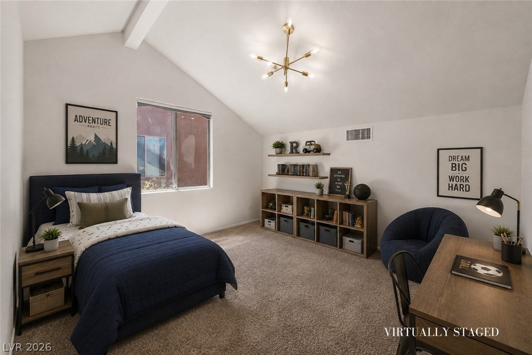 792 Valley Rise Drive, Henderson, NV 89052 Vaulted ceilings and plush carpeting elevate this comfortable bedroom with ample natural light.