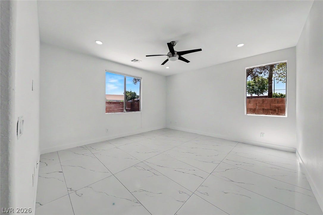 792 Valley Rise Drive, Henderson, NV 89052 Gleaming marble-look tile floors and dual windows establish a clean, contemporary ambiance.