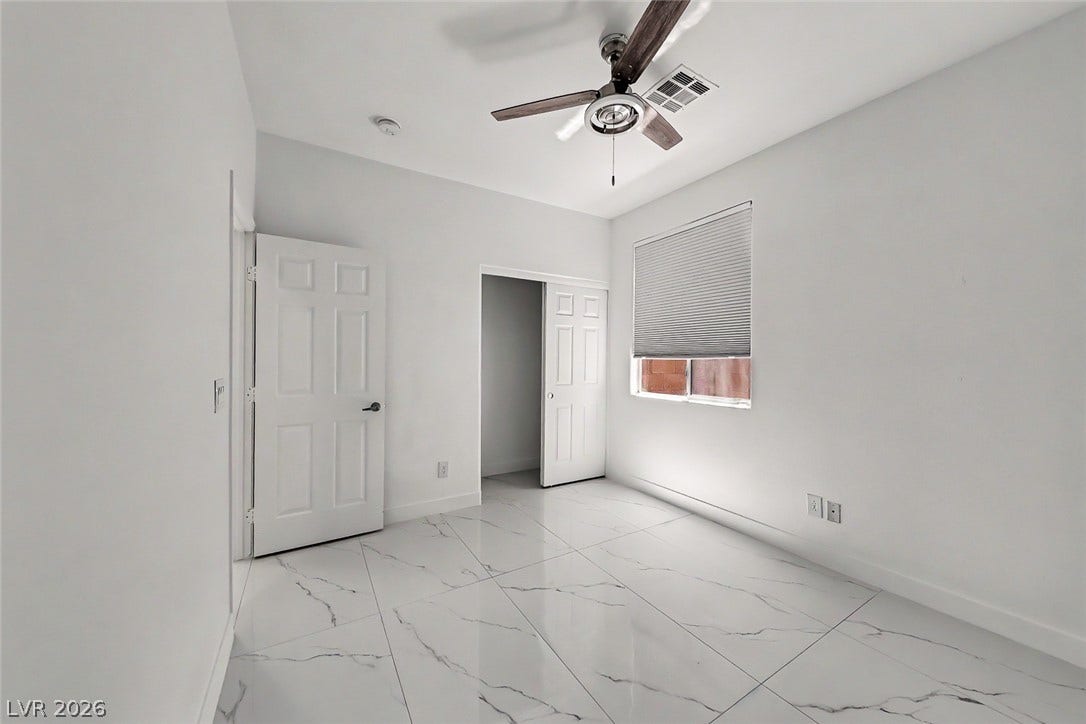 792 Valley Rise Drive, Henderson, NV 89052 Polished tile flooring and clean lines define this versatile auxiliary bedroom space.