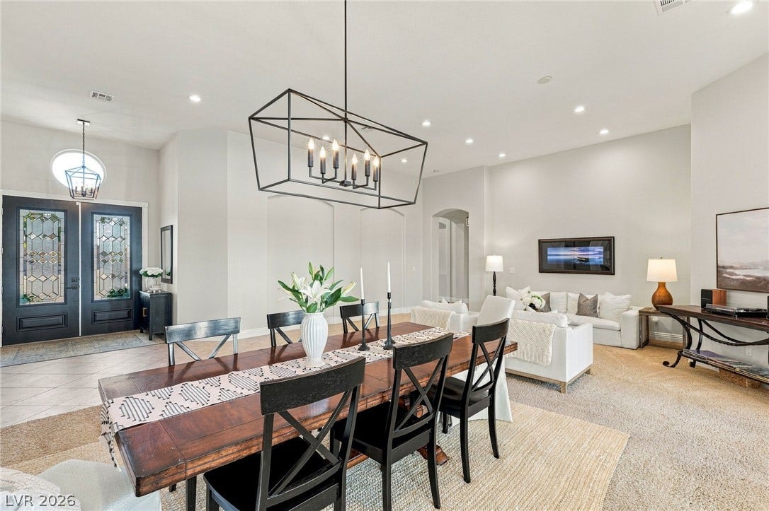 210 Torrey Morgan Way, Henderson, NV 89074 Gleaming hardwood floors and a lofty ceiling define this expansive open-concept living area.