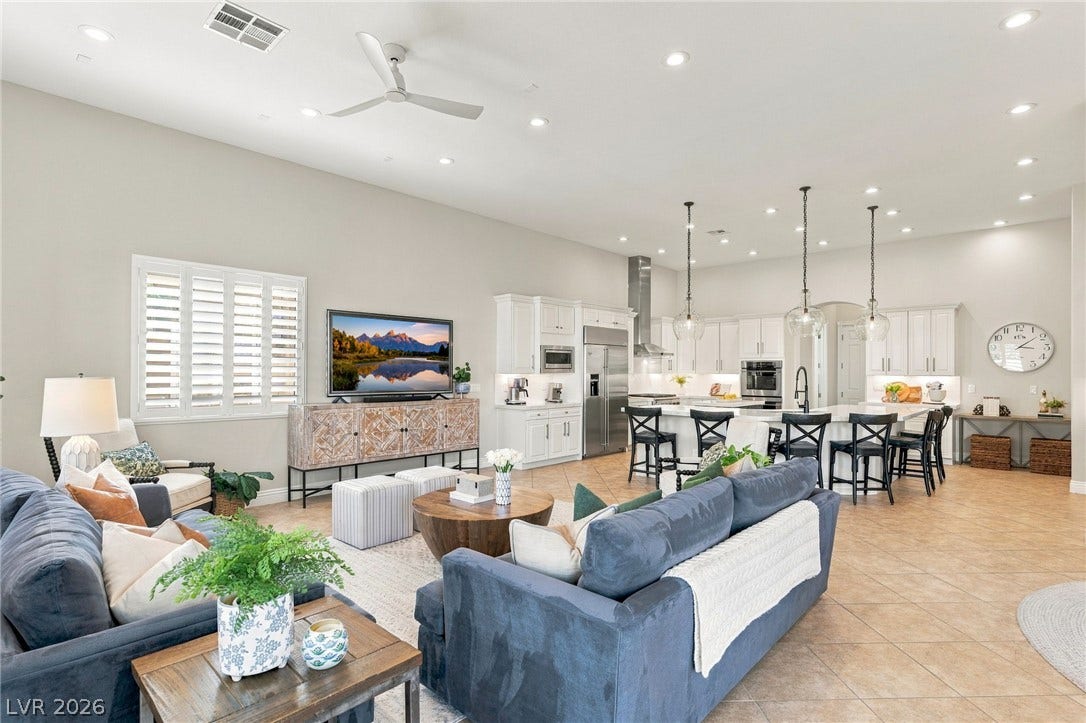 210 Torrey Morgan Way, Henderson, NV 89074 Gleaming tile floors and recessed lighting enhance this expansive open-concept living area.