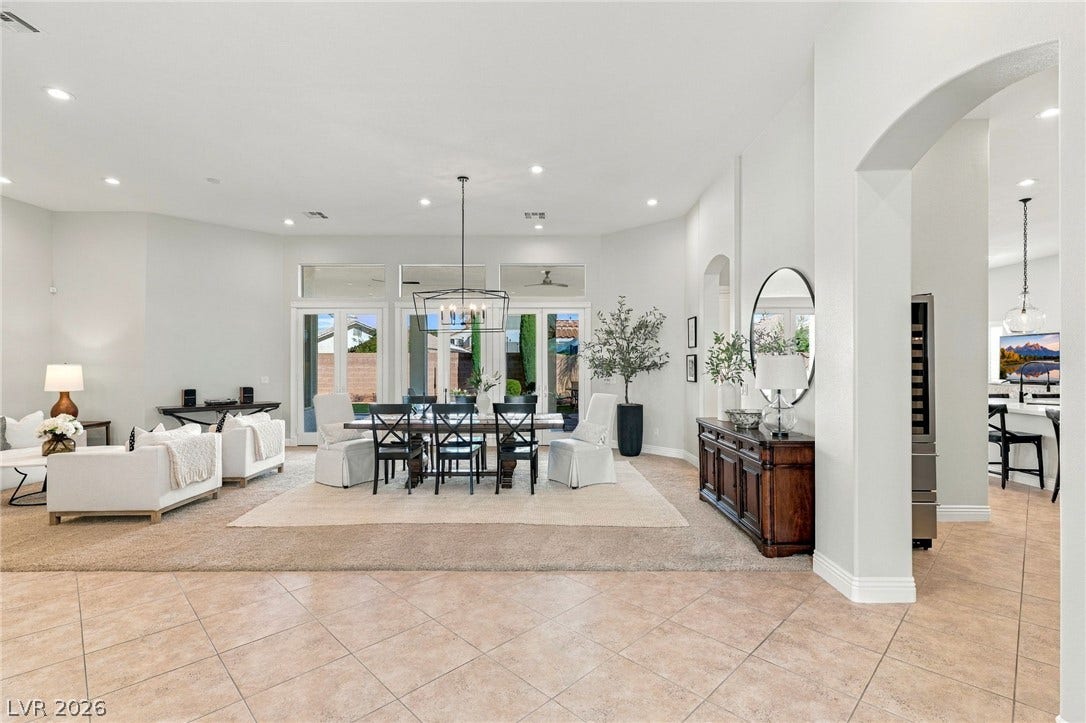210 Torrey Morgan Way, Henderson, NV 89074 An open floor plan connects the tiled entry to a formal dining space.
