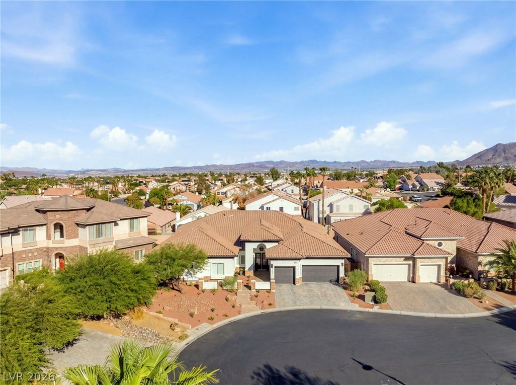 210 Torrey Morgan Way, Henderson, NV 89074 A quiet cul-de-sac location highlights this classic stucco residence under a tiled roof.