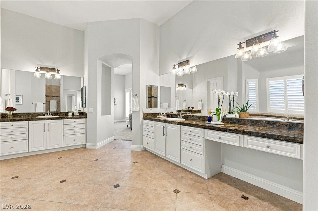 210 Torrey Morgan Way, Henderson, NV 89074 High ceilings and extensive tiled flooring enhance the scale of this master bathroom.