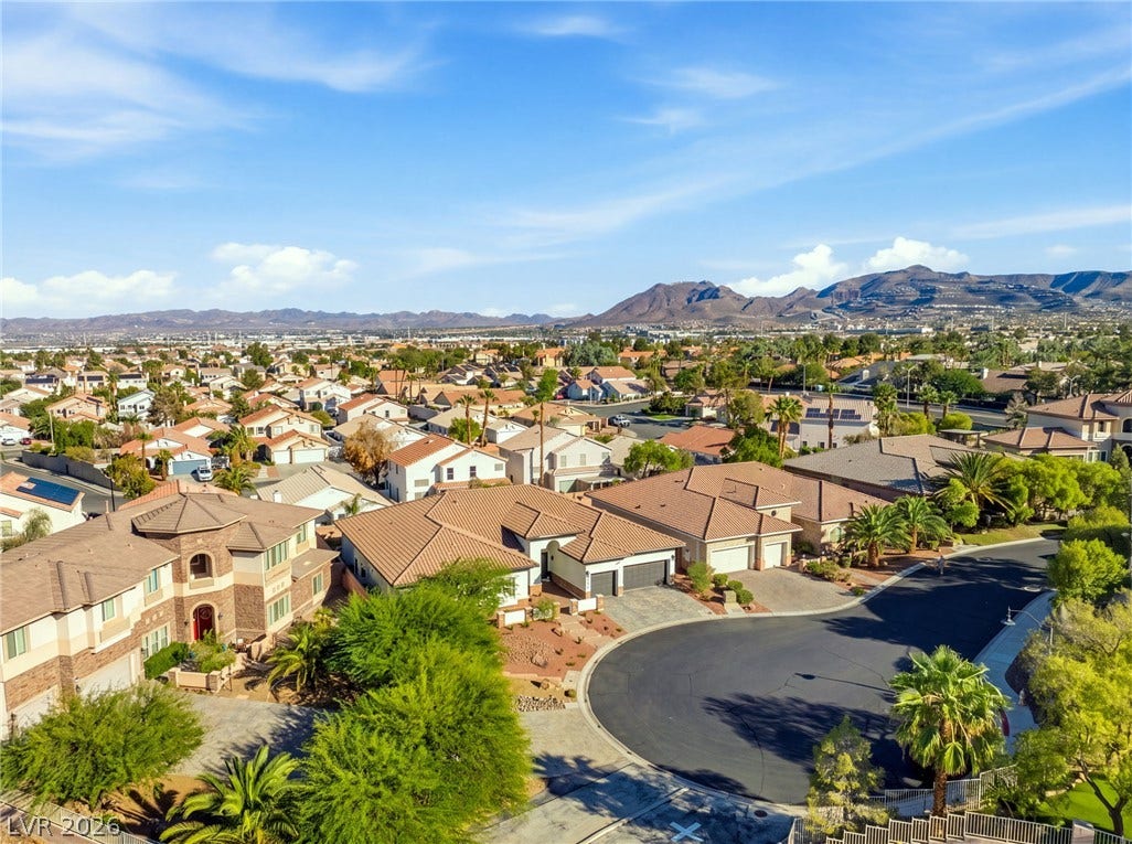210 Torrey Morgan Way, Henderson, NV 89074 Sweeping mountain vistas frame the quiet residential street in this tranquil neighborhood setting.