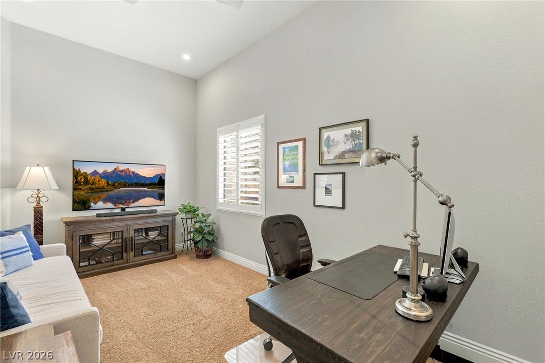 210 Torrey Morgan Way, Henderson, NV 89074 High ceilings and plantation shutters bring a light, architectural feel to this quiet study space.