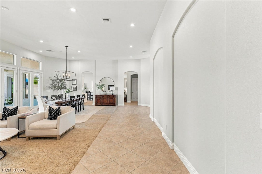 210 Torrey Morgan Way, Henderson, NV 89074 High ceilings and clean architectural lines define this expansive, tile-floored entry hall.