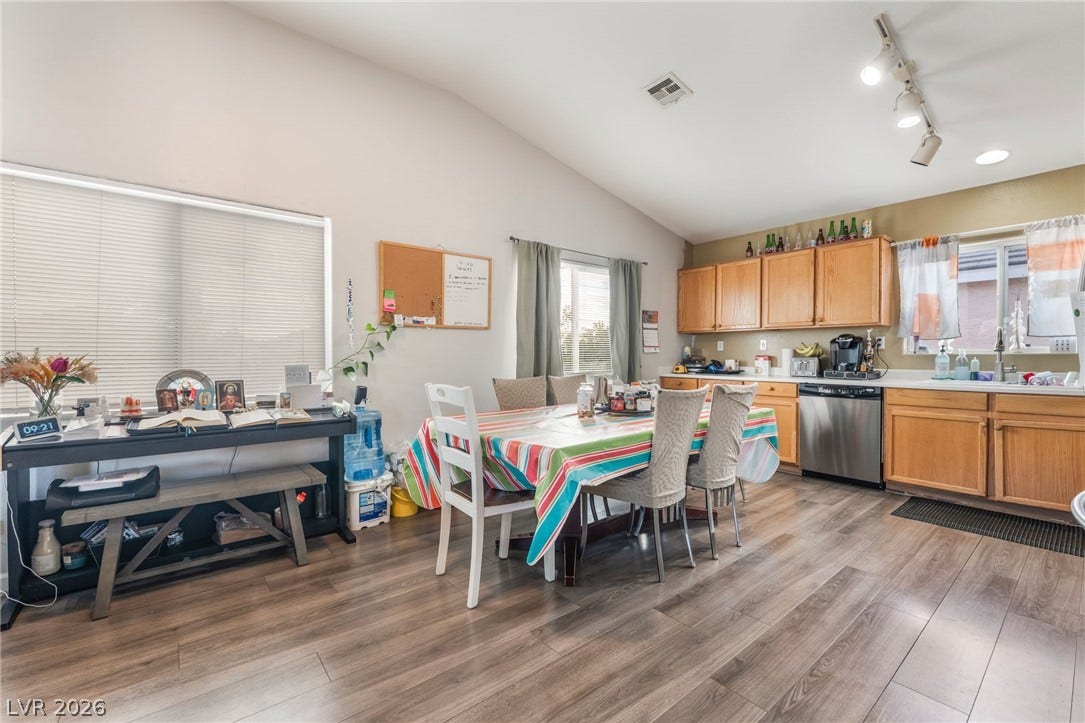5348 Reardon Court, North Las Vegas, NV 89031 A spacious kitchen and dining area features vaulted ceilings and resilient wood-look flooring.