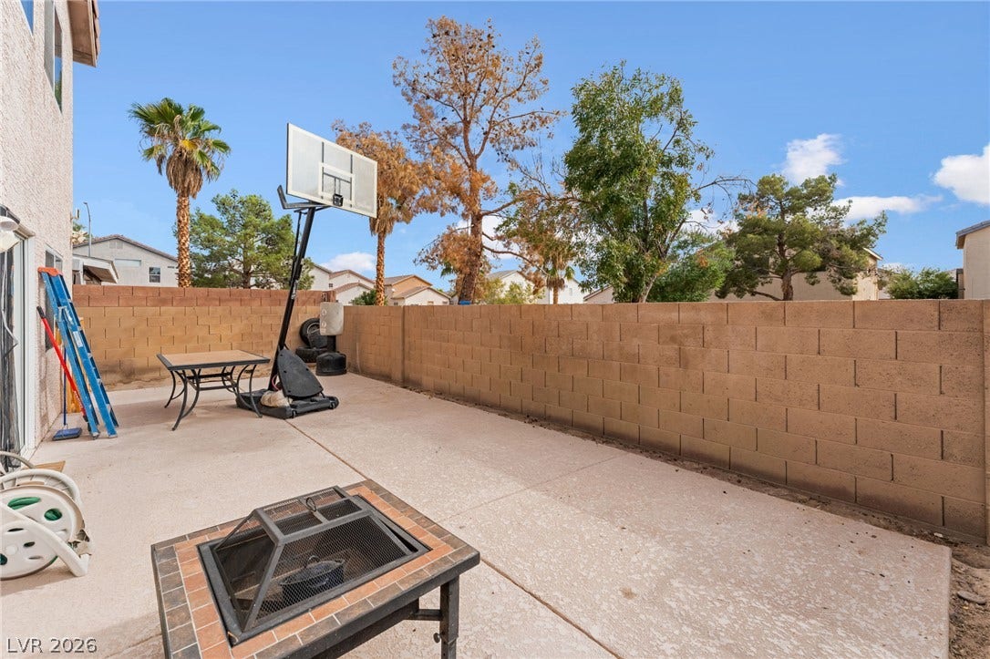 5348 Reardon Court, North Las Vegas, NV 89031 An enclosed concrete patio area provides a private outdoor retreat bordered by high block wall fencing.