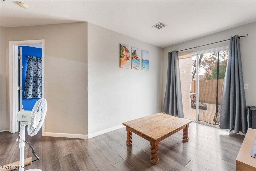 5348 Reardon Court, North Las Vegas, NV 89031 Sliding glass doors open directly to the backyard patio from this versatile living area.
