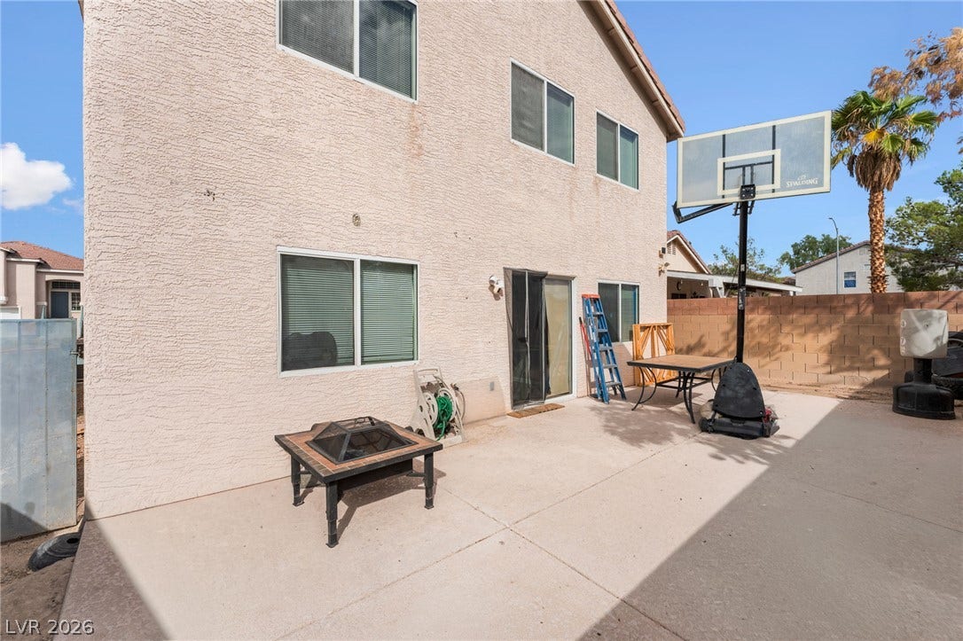 5348 Reardon Court, North Las Vegas, NV 89031 A spacious concrete patio stretches along the back of this stucco-finished home.