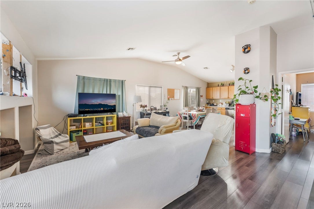 5348 Reardon Court, North Las Vegas, NV 89031 Polished wood-plank flooring and vaulted ceilings define this inviting, open-concept living space.