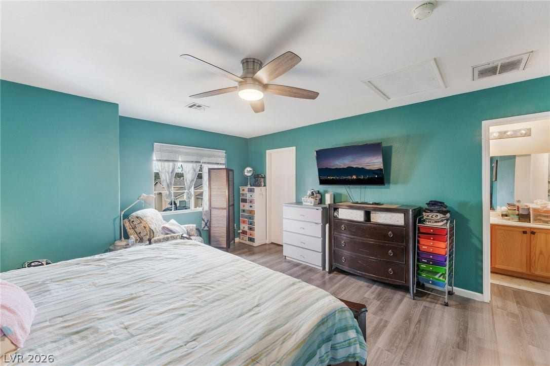 5348 Reardon Court, North Las Vegas, NV 89031 Smooth wood-plank flooring runs throughout this comfortable primary bedroom suite.