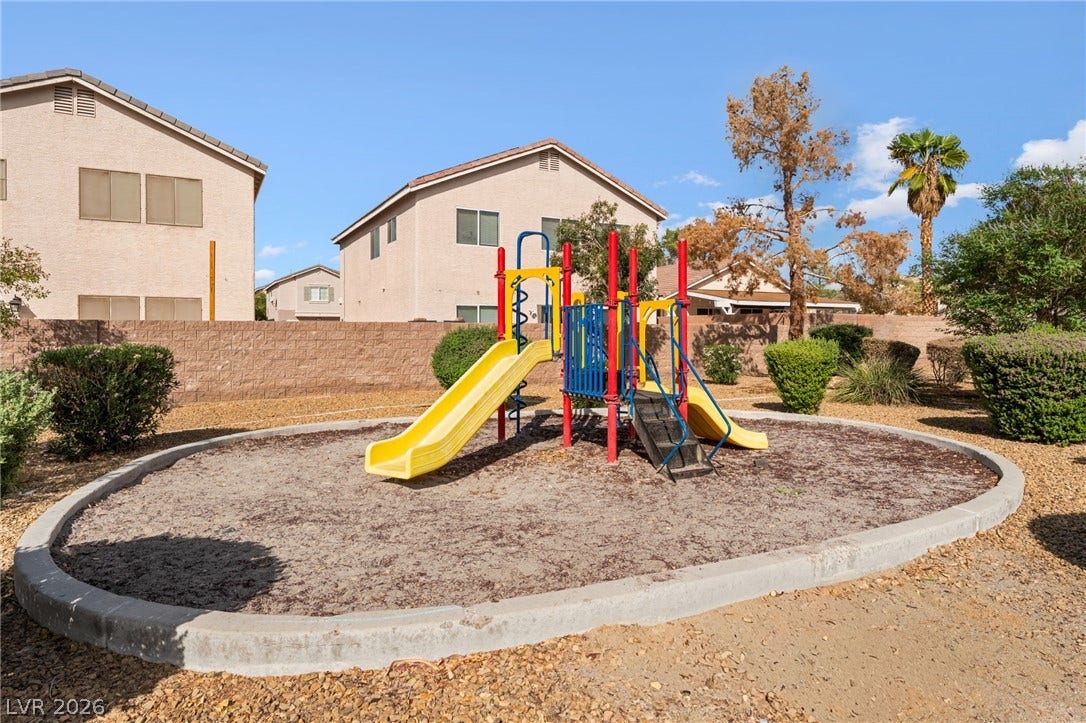 5348 Reardon Court, North Las Vegas, NV 89031 An outdoor playground area sits enclosed within a neighborhood common space.